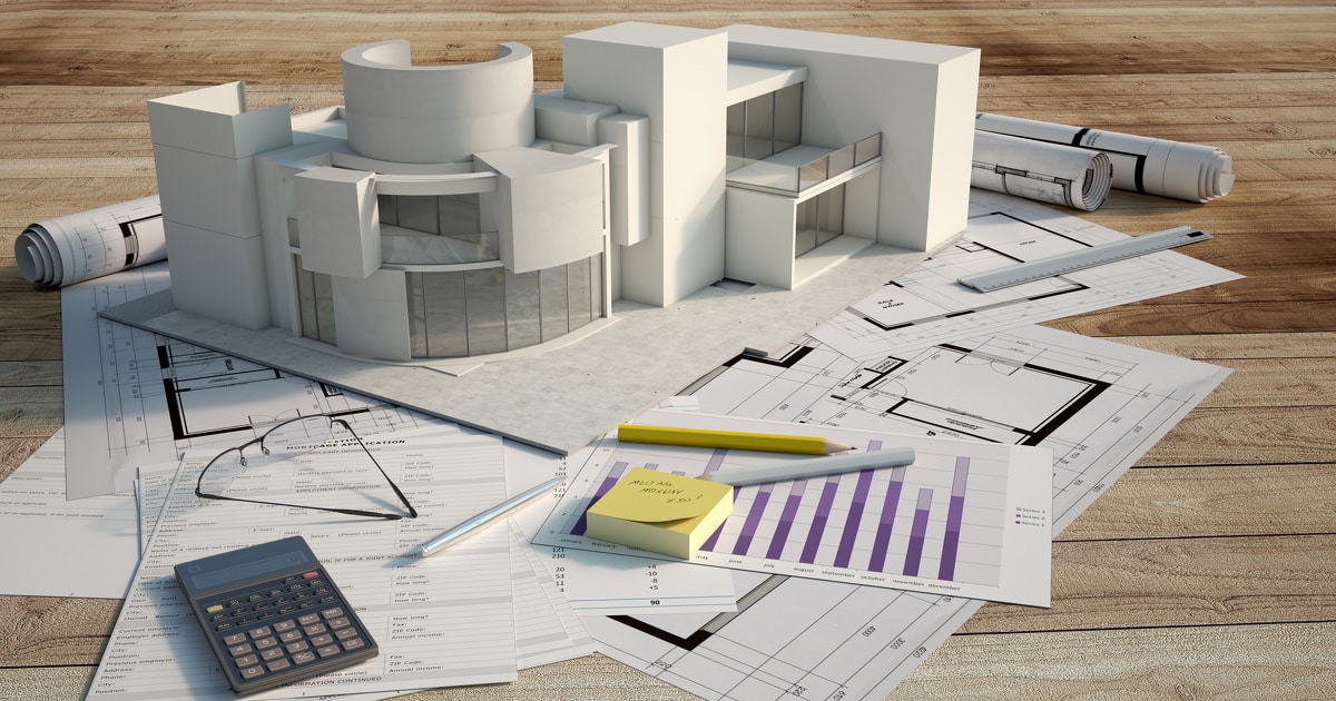 Maquette 3D d'un bâtiment sur des documents de prêt immobilier
