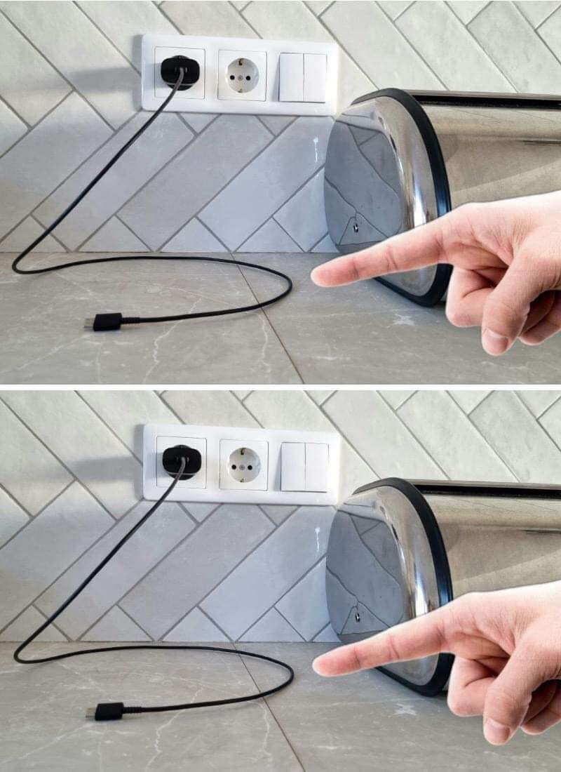 Personne débranchant un chargeur de la prise murale