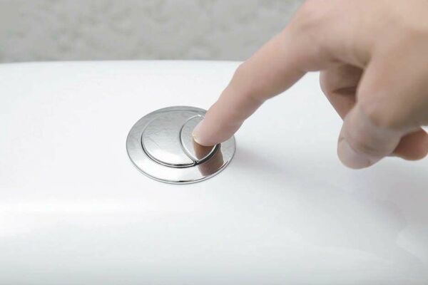 Schéma explicatif du fonctionnement d'une chasse d'eau à double commande